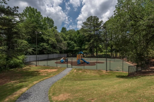 Pet-Friendly Apartments in Lawrenceville– Park on Sweetwater – a tennis court