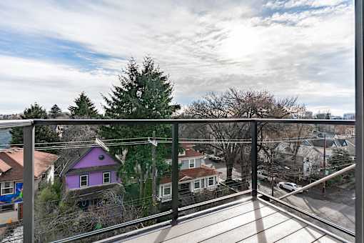 A purple house is seen from a balcony.