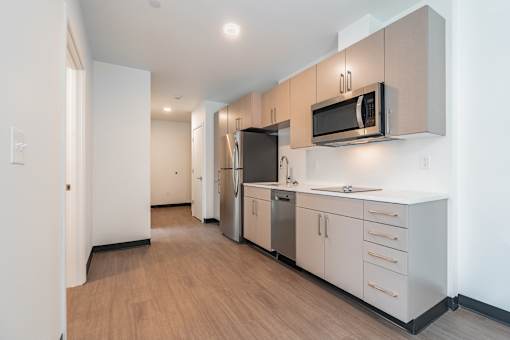 A kitchen with a microwave above the stove.