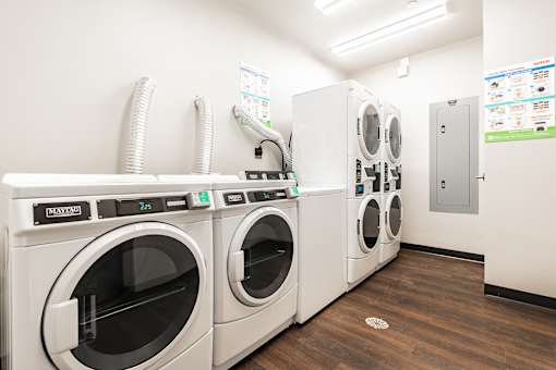 A row of washing machines in a laundromat.