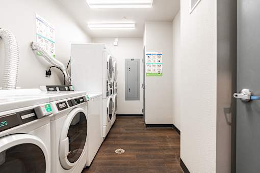 A laundromat with washers and dryers.