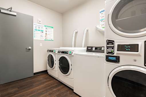 A row of washing machines in a laundromat.