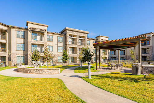 A large building with a courtyard in front of it.