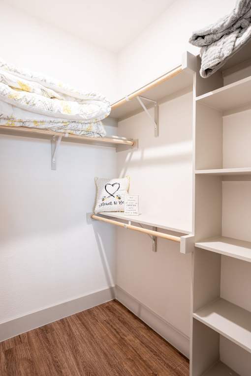 A white shelf with a sign that says "silent to op" is in a room with white walls.