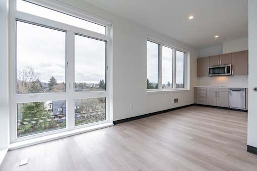 A kitchen area with a microwave and a dishwasher.