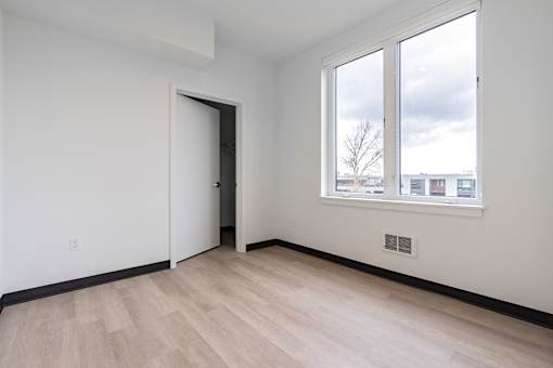 A room with a door and a window.