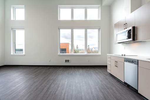 A kitchen with a microwave on the counter.