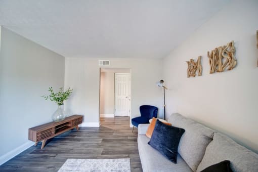 a living room with a couch and a chair