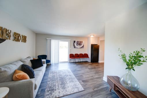 a living room with a couch and chairs