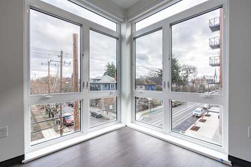 A view of a street through a large window.