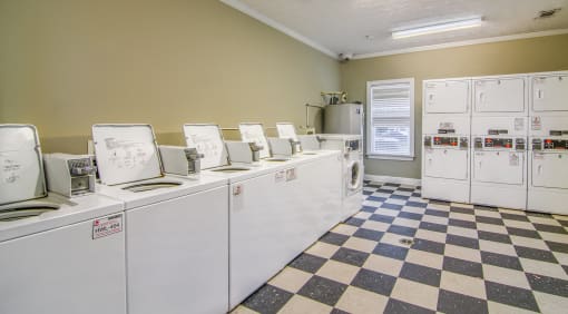 a laundry room full of washers and dryers