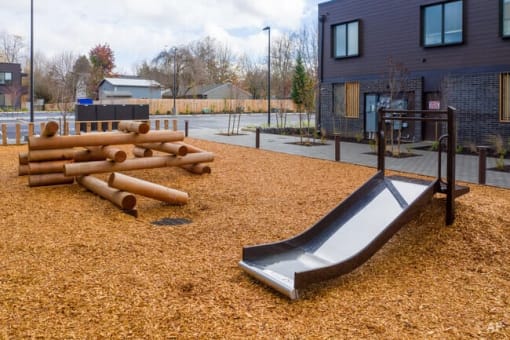 a slide and logs in a playground