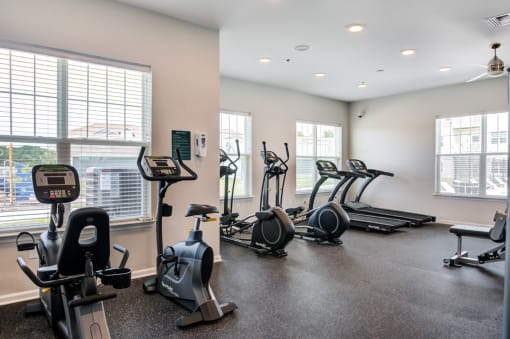 Fitness center with cardio equipment including bikes and treadmill