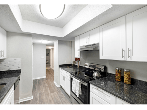 Springdale Glen apartments in Clarkston Georgia photo of kitchen with stainless steel appliances