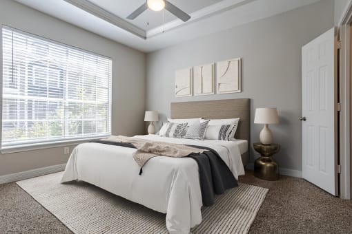 Apartments near Alief Texas for Rent – Gramercy Park – bedroom with ceiling fan, plush carpeting and large window
