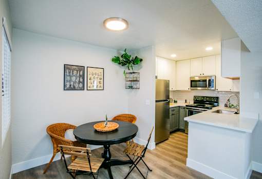 Dining area and kitchen in a one- or two-bedroom apartment at Haven at Lone Mountain in Las Vegas, NV