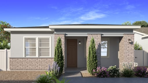 a small brick house with a front door