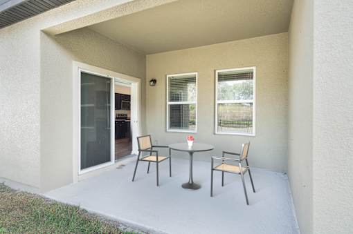 A patio with a table and chairs is shown.