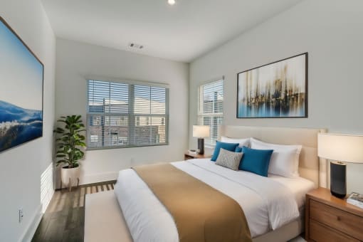 Henley Avondale Townhomes near Scottdale, GA photo of a bedroom with a bed and two windows