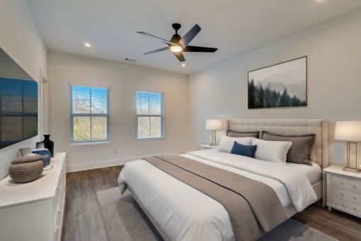 Luxury Three Bedroom Townhomes in Avondale Estates, GA – Henley Avondale – bedroom with a bed and a ceiling fan and hardwood flooring