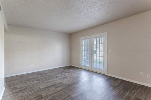 Apartments in Antioch, TN 37013 for Rent – Hickory Lake - A room with a sliding glass door and wood flooring.