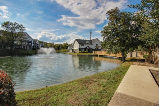 Pet-Friendly Apartments in Antioch, TN– Hickory Lake – a pond with a fountain and apartments