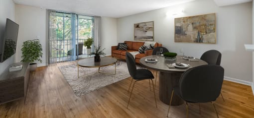 Horizons North Apartments near Miami Gardens Florida photo of an open living room and dining room with a large sliding glass door leading to a balcony
