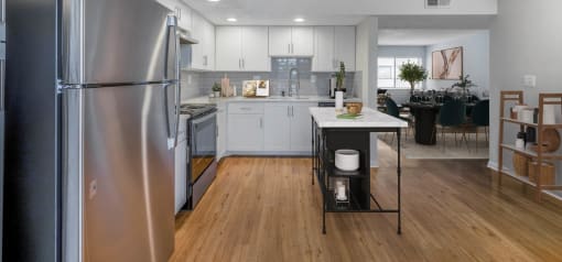 Horizons North Apartments near North Miami Beach Florida Photo Of a kitchen with white cabinets and stainless steel appliances