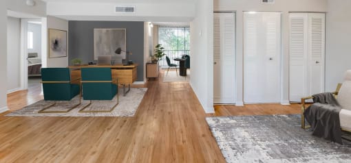 Horizons North Apartments near Carver Ranches, West Park, Florida photo of a living room with hardwood floors and white walls
