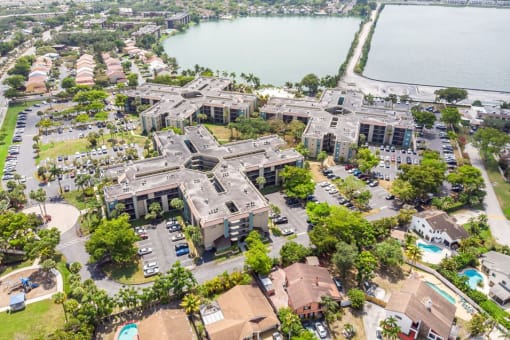 Horizons North Apartments in Miami Florida photo of an aerial view of a large building with a lake in the background