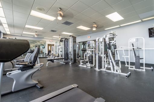 Horizons North Apartments near Ojus, Fl photo of our fitness center with weight lifting equipment