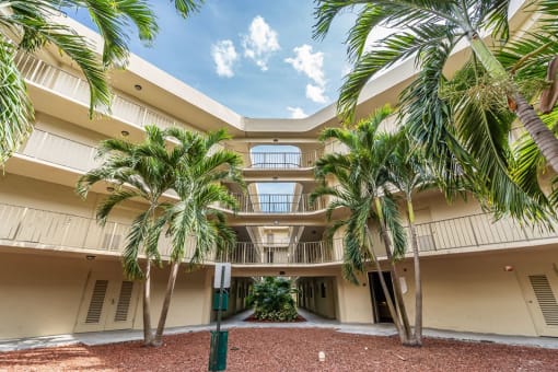 Horizons North Apartments near North Miami Beach Florida Photo Of a large building with palm trees in front of it