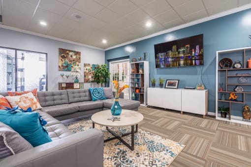 Horizons North Apartments near Aventura, FL photo of a clubhouse room with couches and a coffee table