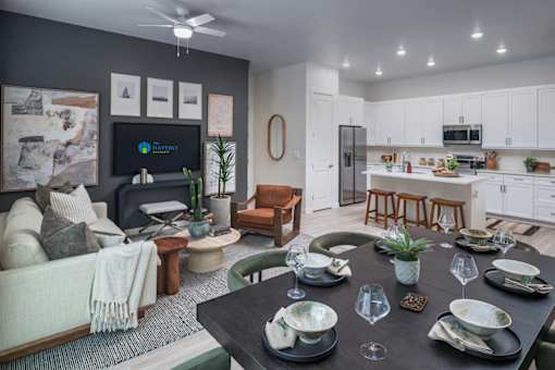 A modern dining room with a black table set for six.
