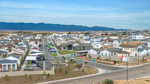 A suburban neighborhood with houses and a road.