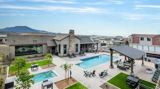 A large house with a pool in the backyard.