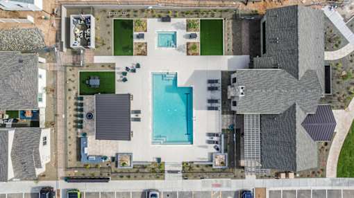 A bird's eye view of a house with a swimming pool.