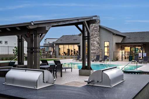 A modern house with a pool and a slide.