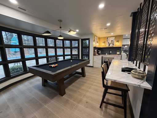 Resident clubhouse at Remington Place Apartments in Raleigh, NC featuring pool table