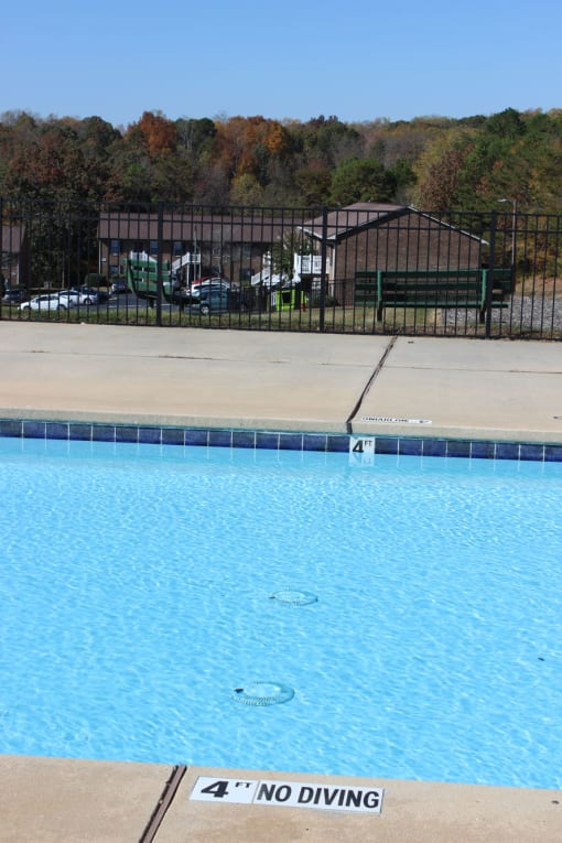 a swimming pool with a no diving sign on the side of it
