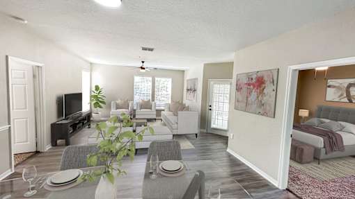 A living room with a grey couch and a television.