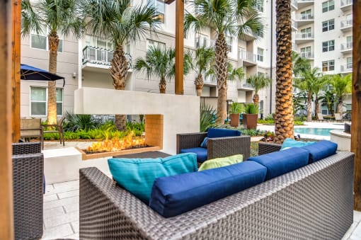 Juno at Winter Park apartments in Winter Park Florida photo of pool deck seating with fire feature