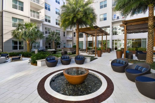 Juno at Winter Park apartments in Winter Park Florida photo of seating at pool deck