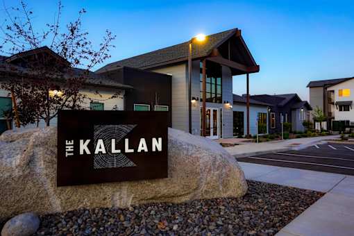 The Kallan sign is in front of a building.