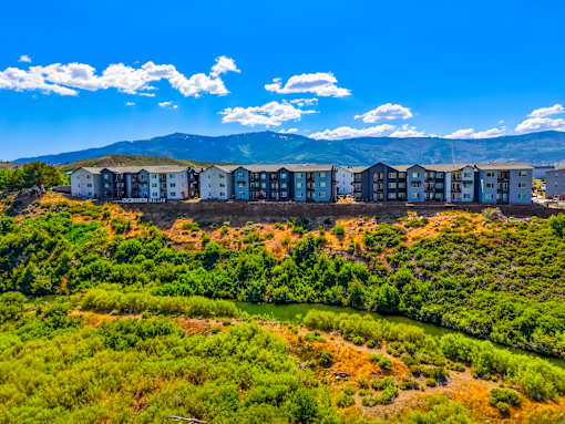A row of houses are built on a hillside.