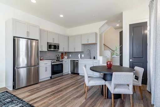 Luxury Atlanta, GA Homes – LaFrance Square – A modern kitchen with a dining table set for two.