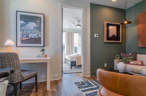 Luxury Homes In Atlanta, GA 30307 for Rent – LaFrance Square – A living room with a brown chair and a white couch.