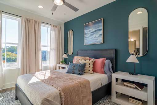 Pet-Friendly Homes In Edgewood, GA – LaFrance Square- A bedroom with a large bed and a ceiling fan.