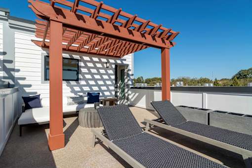 Pet-Friendly Homes In Edgewood, GA – LaFrance Square- A patio with a pergola and lounge chairs.