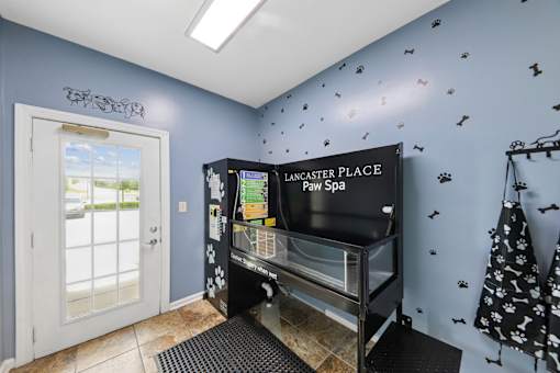 Resident pet spa at Lancaster Place Apartments in Calera, AL with a professional dog washing station and convenient pet grooming area for residents and their pets.